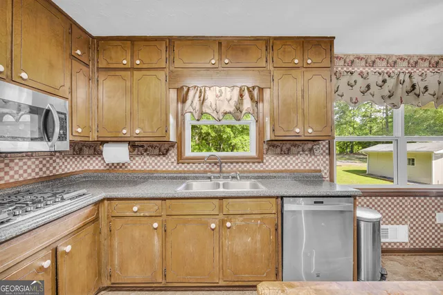 a view of workspace with wooden floor and windows