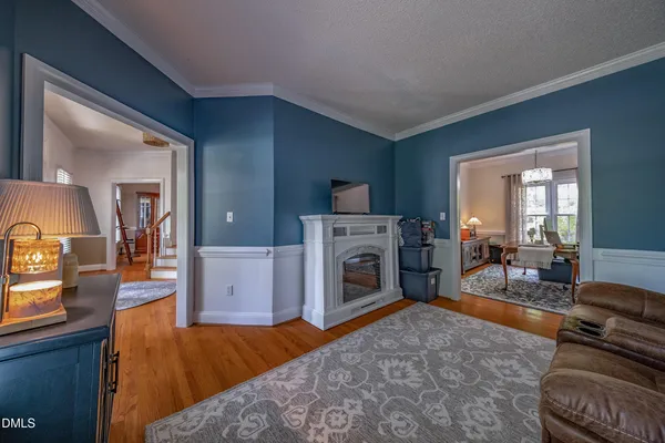 a kitchen with granite countertop a sink cabinets stainless steel appliances and a window