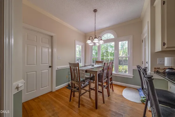 a kitchen with a stove and cabinets