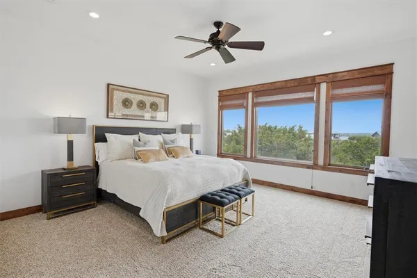 a bedroom with a bed and a television