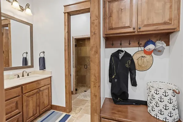 a bathroom with 2 sink and a mirror