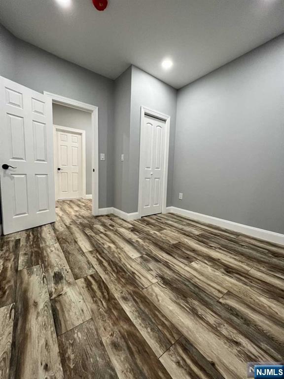 326 70th Street, Unit 2 Guttenberg, NJ 07093 - Photo 11 of 15 a bedroom with a bed and cabinets