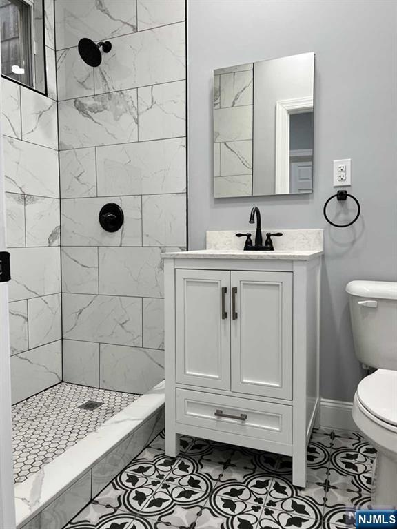 326 70th Street, Unit 2 Guttenberg, NJ 07093 - Photo 12 of 15 a bathroom with a sink a toilet and shower