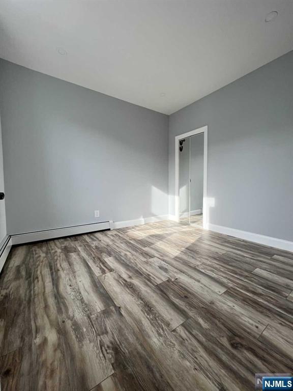 326 70th Street, Unit 2 Guttenberg, NJ 07093 - Photo 13 of 15 a view of empty room with wooden floor