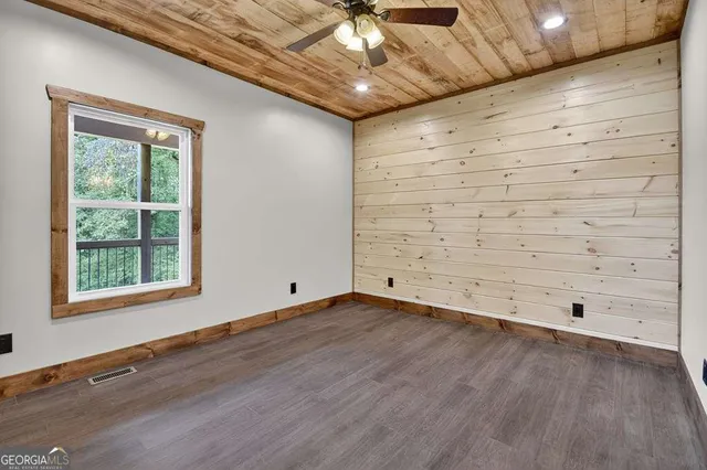 a view of a livingroom with wooden floor