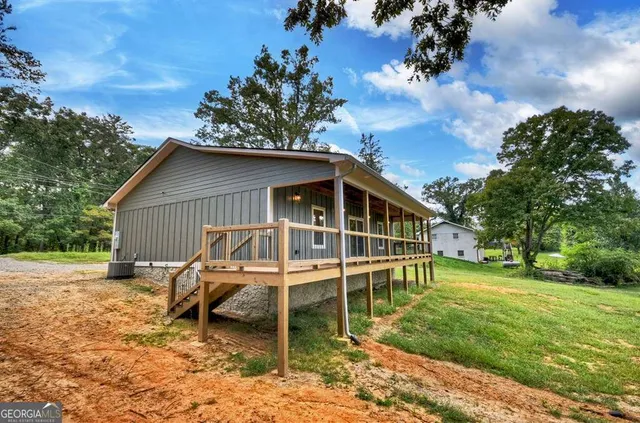 a house with trees in the background