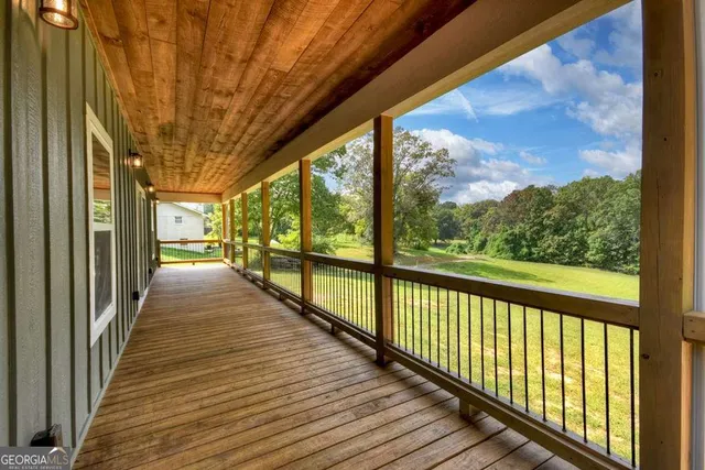 a view of a balcony with wooden floor