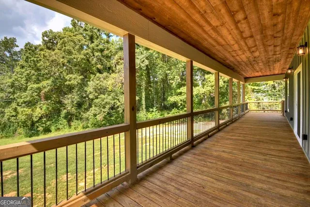a view of a balcony with wooden floor