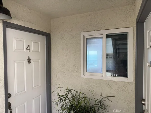a living room with furniture and flowers