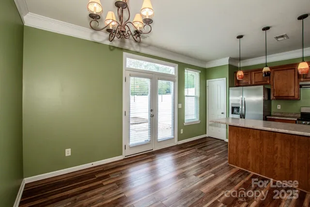 a open kitchen with window and stainless steel appliances