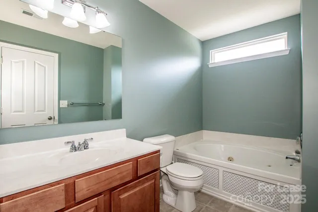 a bathroom with a bathtub a sink and a toilet