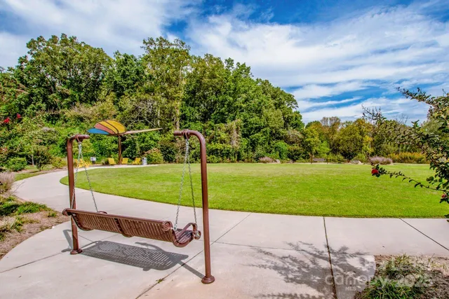 a view of a park with large trees