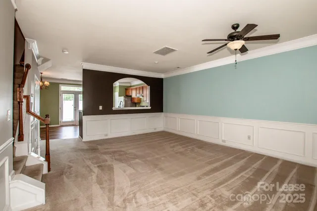 a view of a room with window and hardwood floor