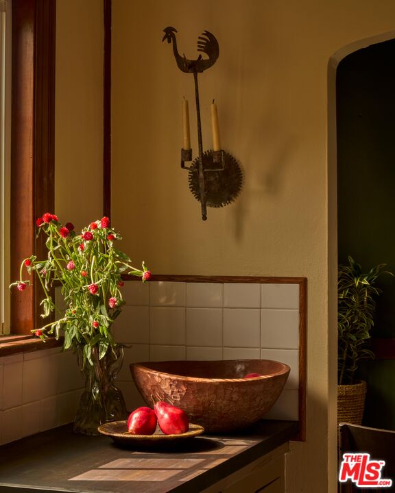 4179 South Van Ness Avenue Los Angeles, CA 90008 - Photo 16 of 44 a bathroom with a sink and a potted plant