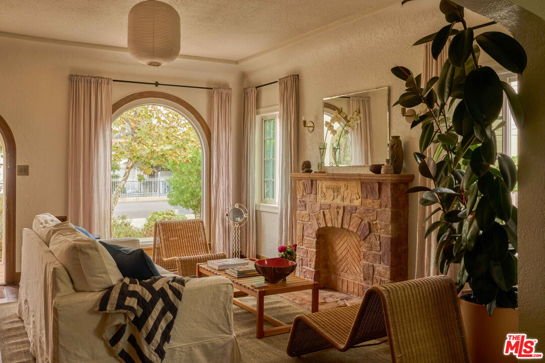 4179 South Van Ness Avenue Los Angeles, CA 90008 - Photo 2 of 44 a living room with furniture fireplace and flat screen tv