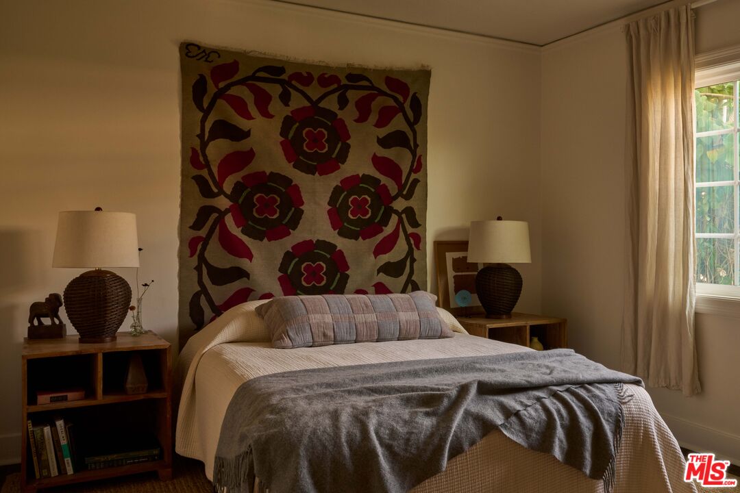 4179 South Van Ness Avenue Los Angeles, CA 90008 - Photo 27 of 44 a bedroom with a bed and wooden floor