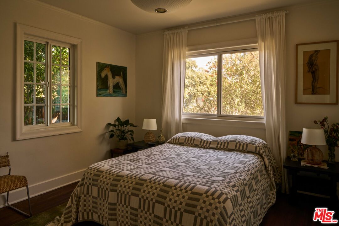 4179 South Van Ness Avenue Los Angeles, CA 90008 - Photo 31 of 44 a bedroom with a bed and a window