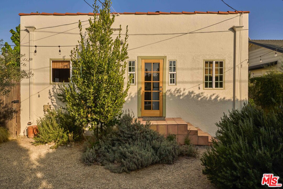 4179 South Van Ness Avenue Los Angeles, CA 90008 - Photo 38 of 44 a front view of a house with plants