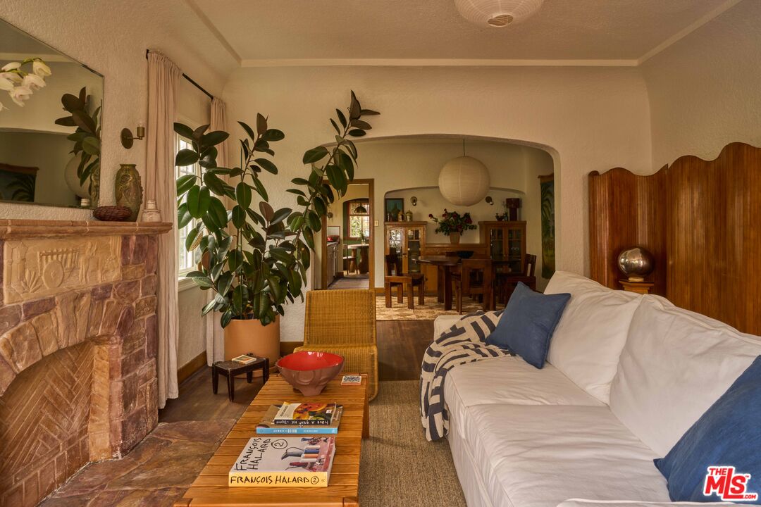4179 South Van Ness Avenue Los Angeles, CA 90008 - Photo 6 of 44 a living room with furniture a chandelier and a wooden floor