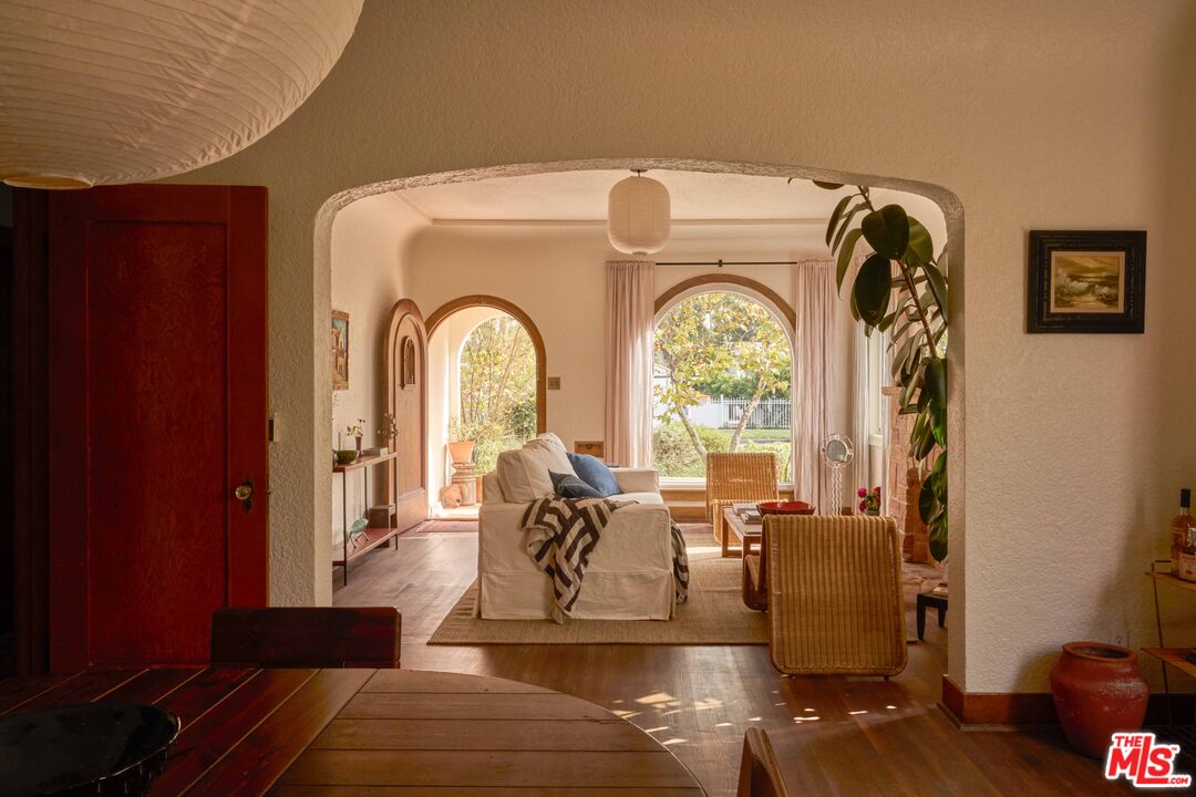 4179 South Van Ness Avenue Los Angeles, CA 90008 - Photo 10 of 44 a living room with couches chairs and couches with wooden floor