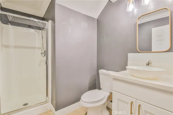 a bathroom with a toilet a sink and a mirror