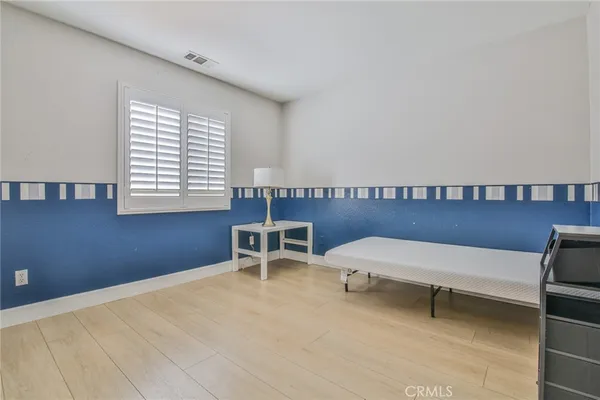a reading room with furniture and a window