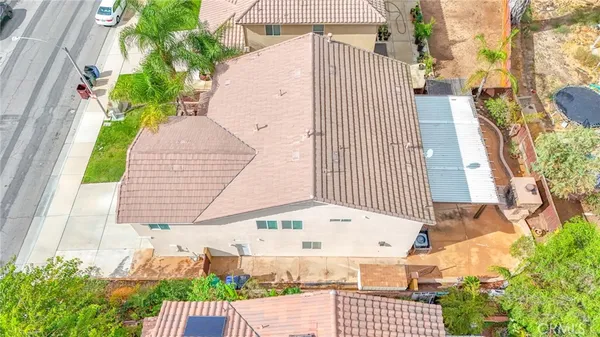 a picture of a brick house with a small yard