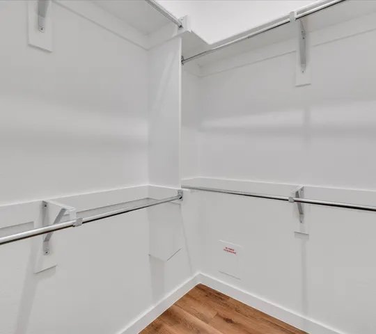 a view of an empty walk in closet