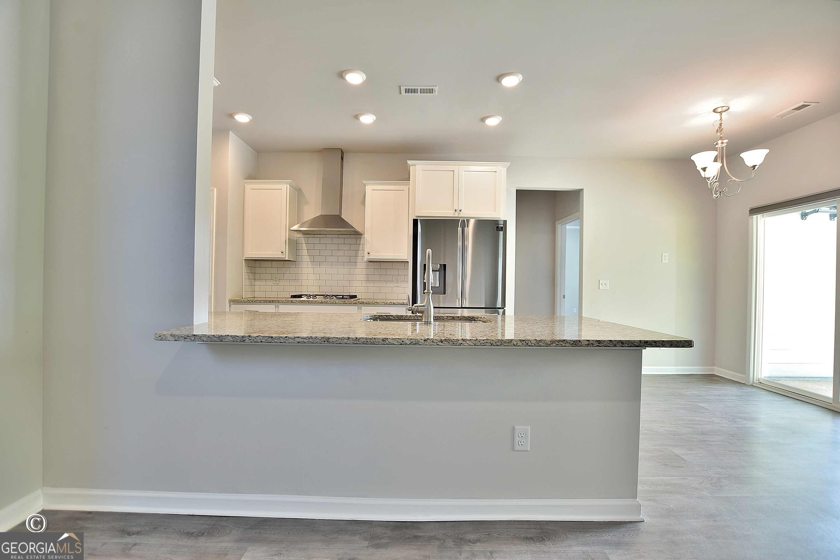 5066 Pond View Court Columbus, GA 31907 - Photo 13 of 30 a view of a kitchen with wooden floor and a window
