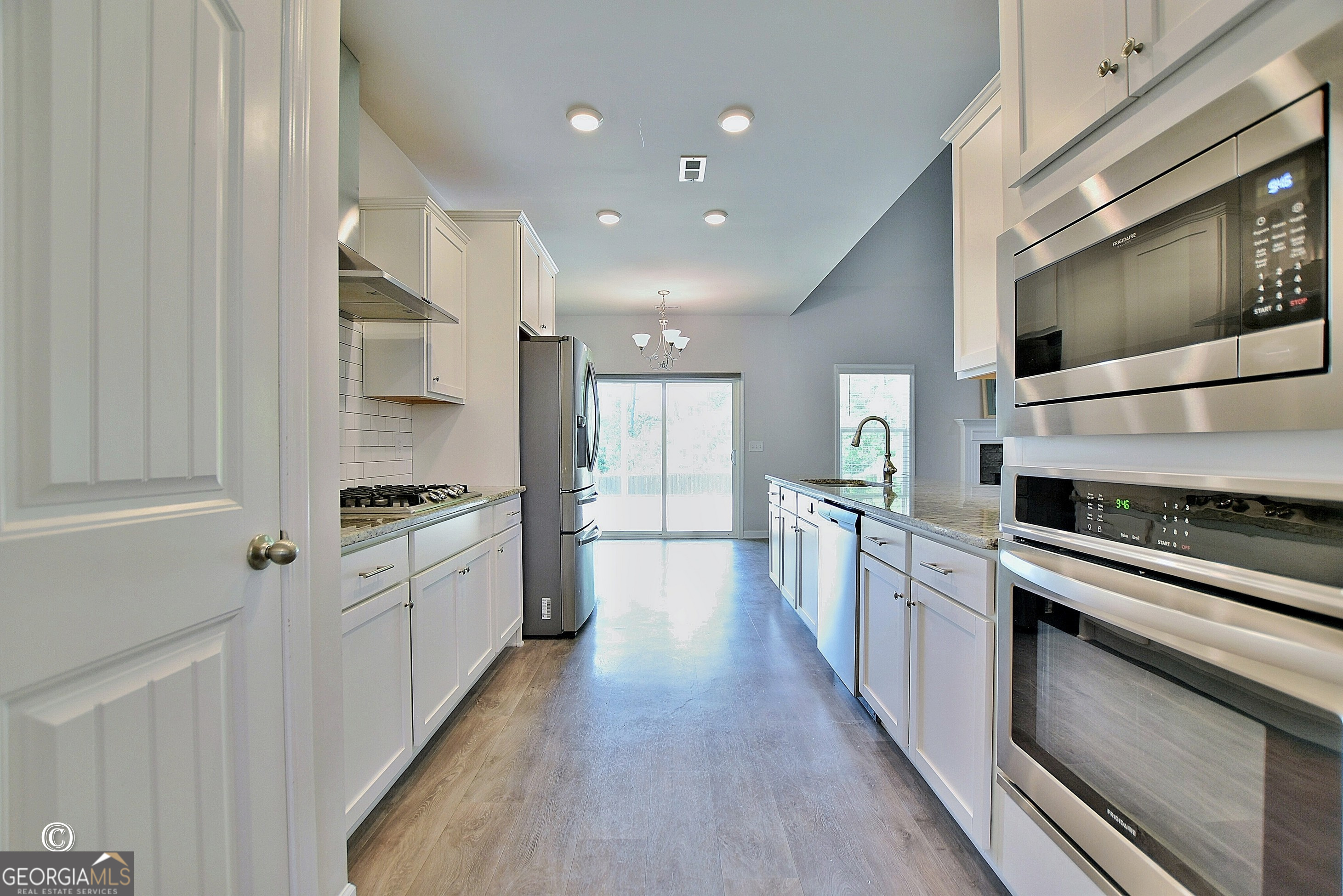 5066 Pond View Court Columbus, GA 31907 - Photo 15 of 30 a large kitchen with stainless steel appliances and white cabinets
