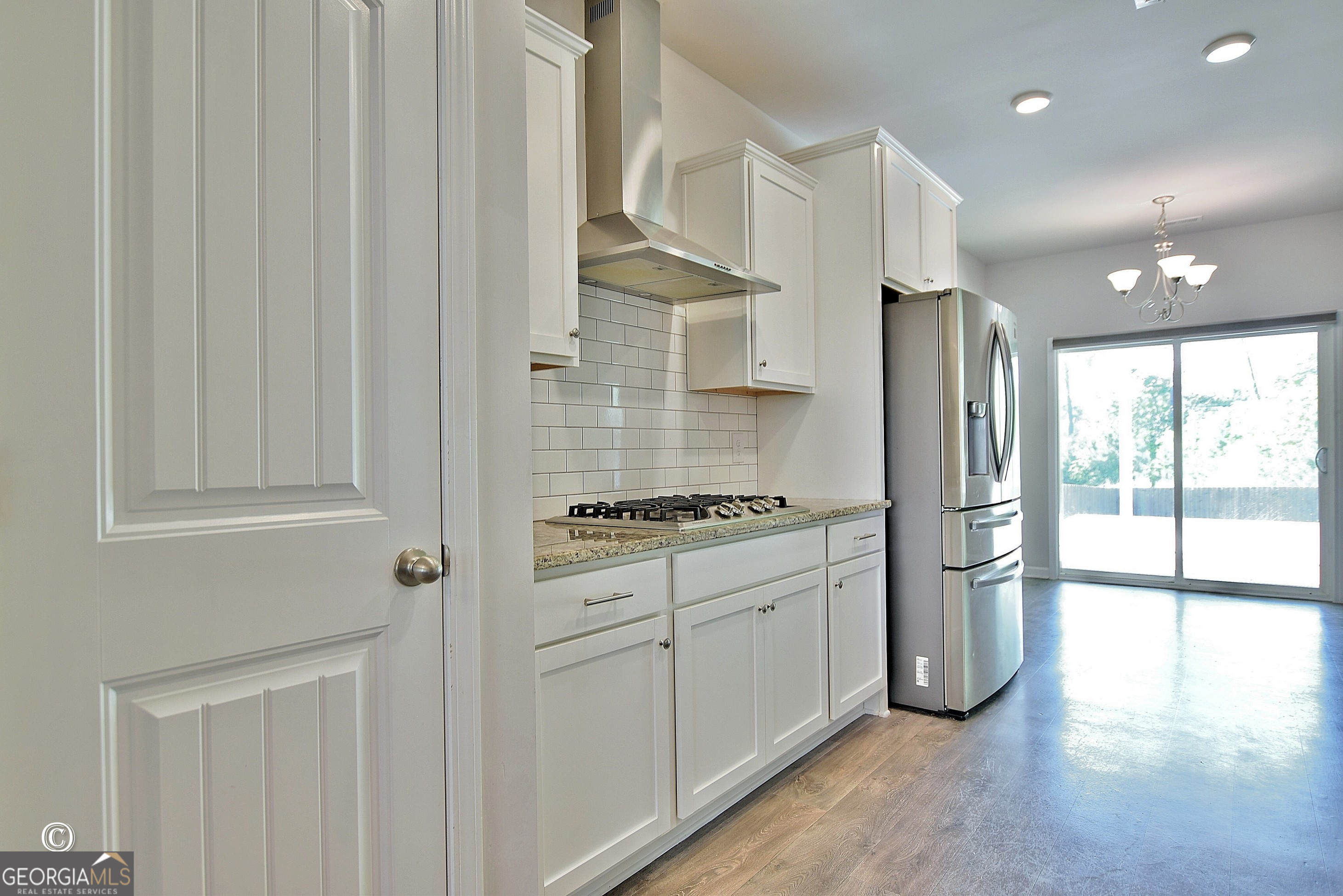 5066 Pond View Court Columbus, GA 31907 - Photo 16 of 30 a kitchen with stainless steel appliances granite countertop a stove a refrigerator and a cabinets with wooden floor