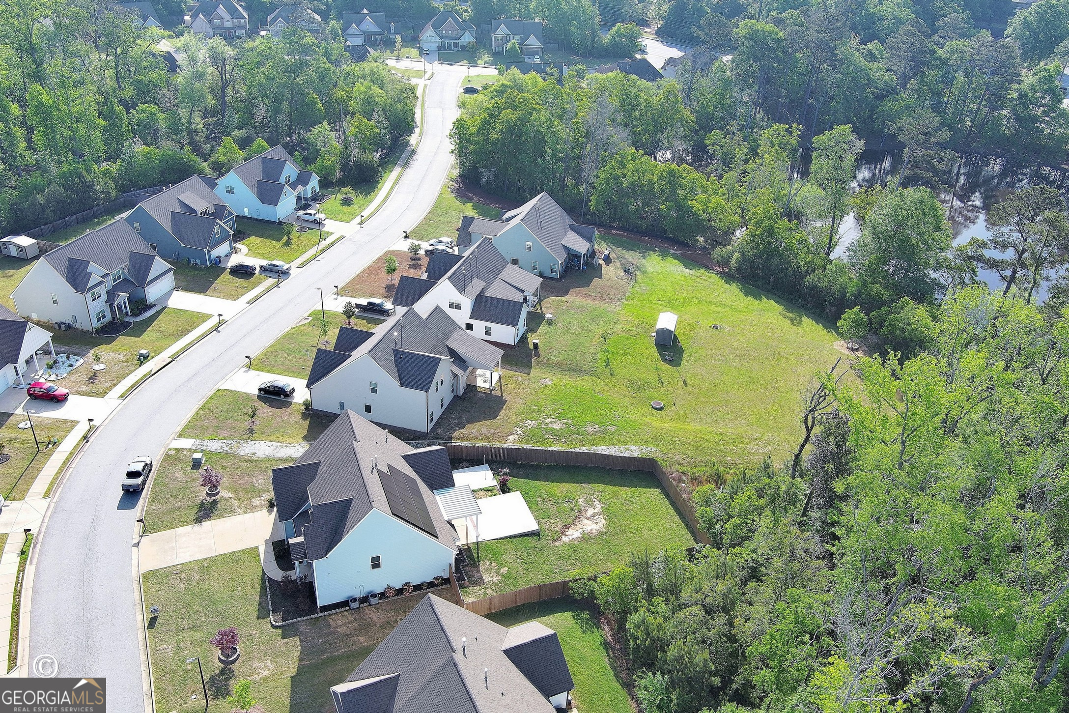 5066 Pond View Court Columbus, GA 31907 - Photo 5 of 30 an aerial view of a house with a swimming pool