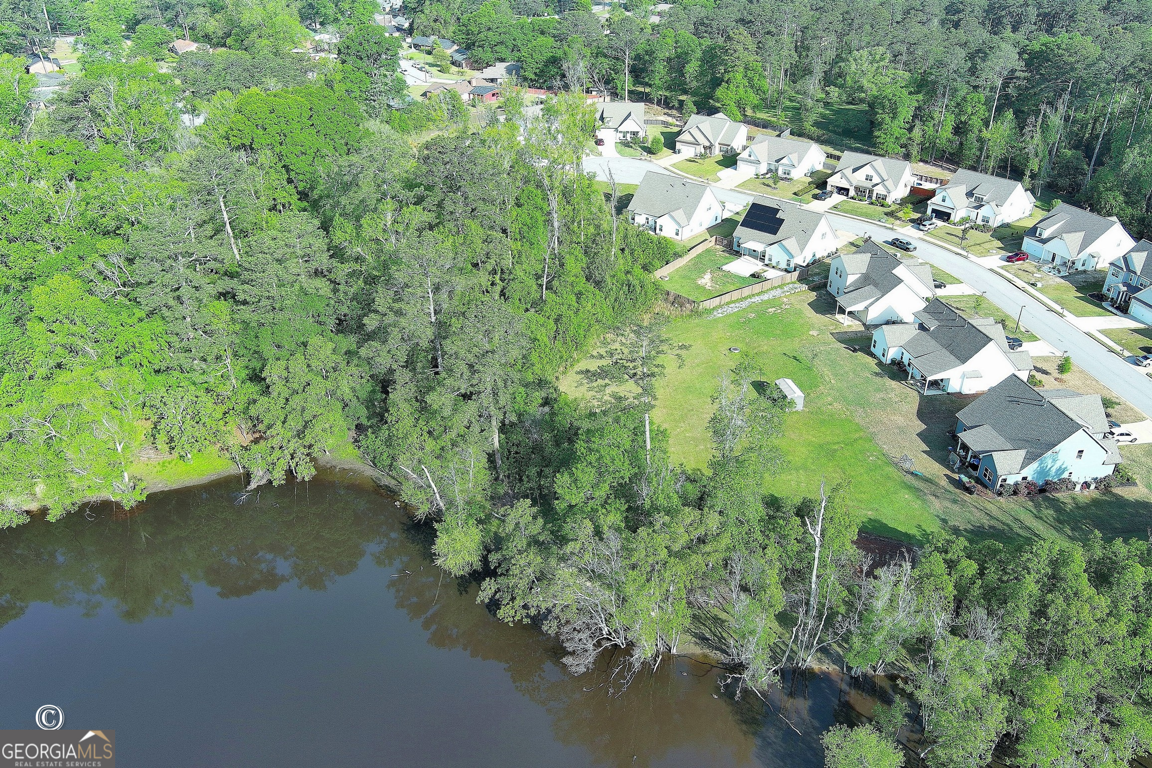 5066 Pond View Court Columbus, GA 31907 - Photo 7 of 30 a view of a lake with a yard