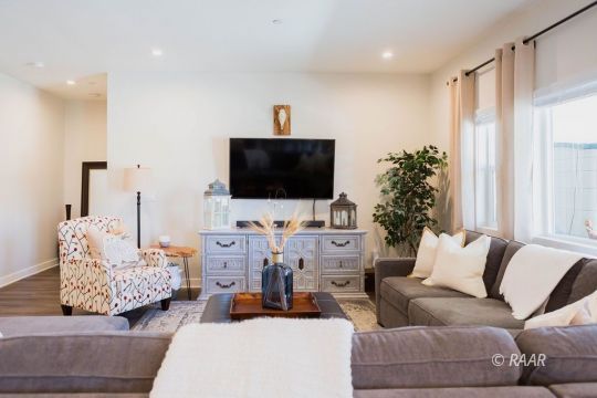 419 Abigail Street Ridgecrest, CA 93555 - Photo 9 of 34 a living room with furniture and a flat screen tv