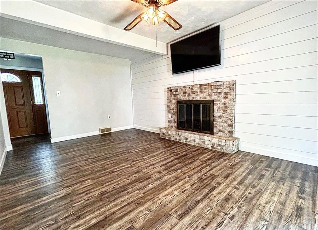 102 Crosslands Road Butler, PA 16002 - Photo 17 of 42 a view of empty room with wooden floor and fireplace