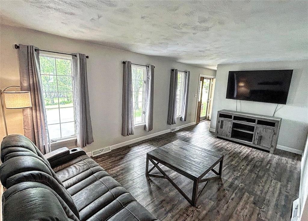 102 Crosslands Road Butler, PA 16002 - Photo 6 of 42 a living room with furniture and a flat screen tv