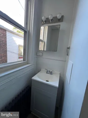 a utility room with a sink dryer and washer