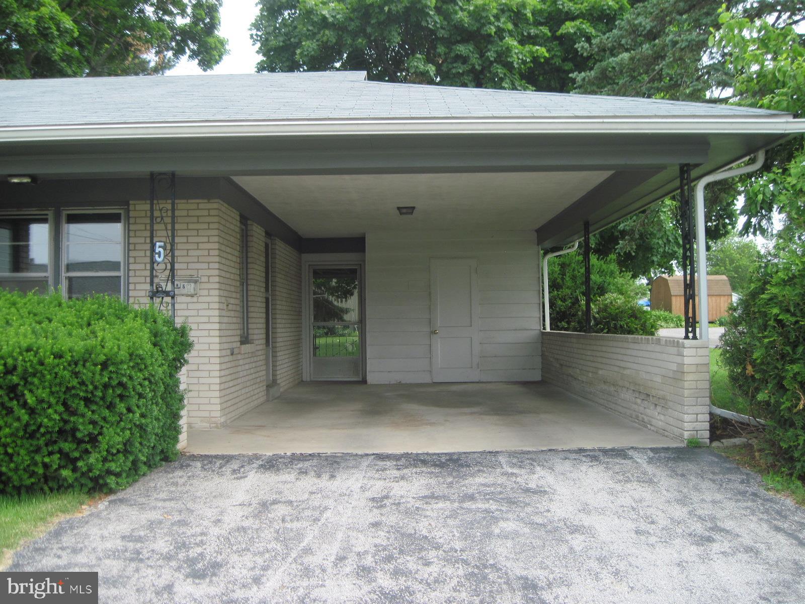 5 Willow Run Road Dover, PA 17315 - Photo 3 of 33 covered carport with storage area