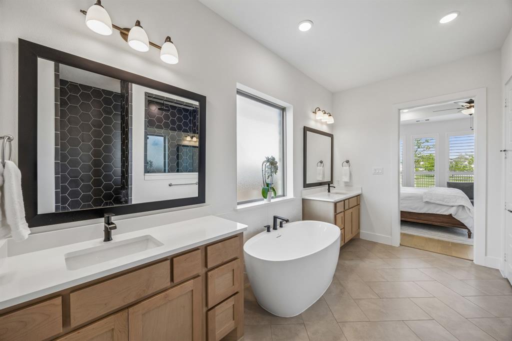 311 Pecan Trail Prosper, TX 75078 - Photo 11 of 39 a bathroom with a sink and a mirror