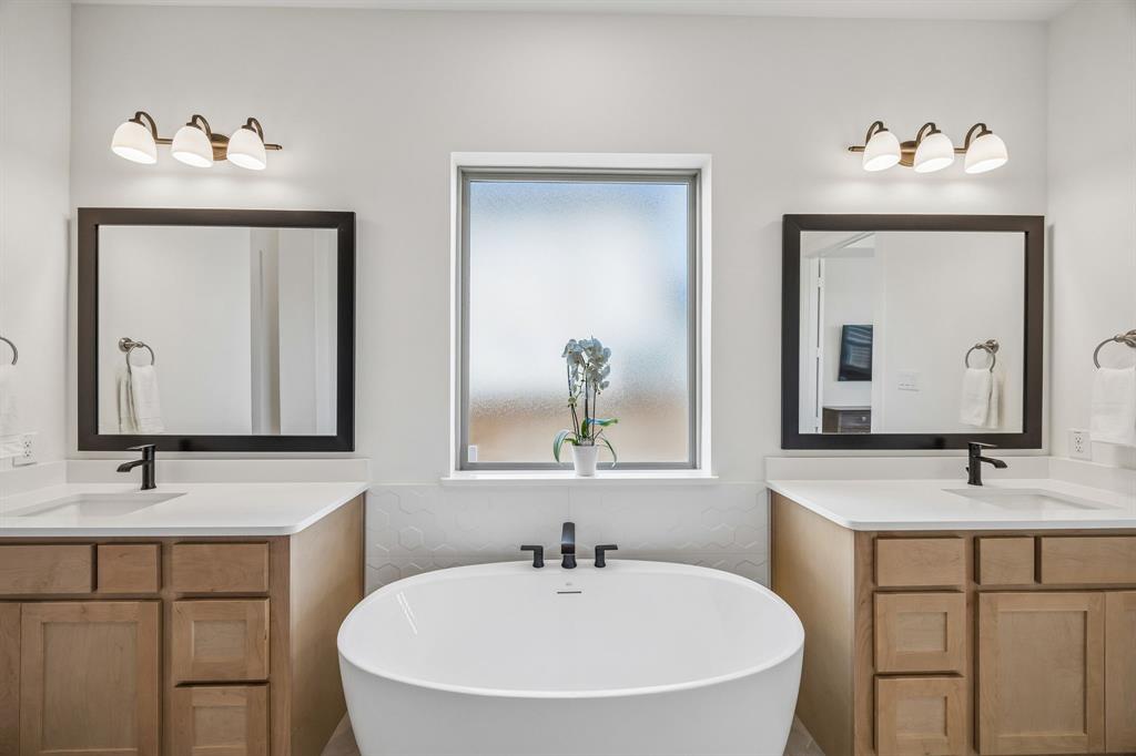311 Pecan Trail Prosper, TX 75078 - Photo 13 of 39 a bathroom with double vanity sinks and a mirror