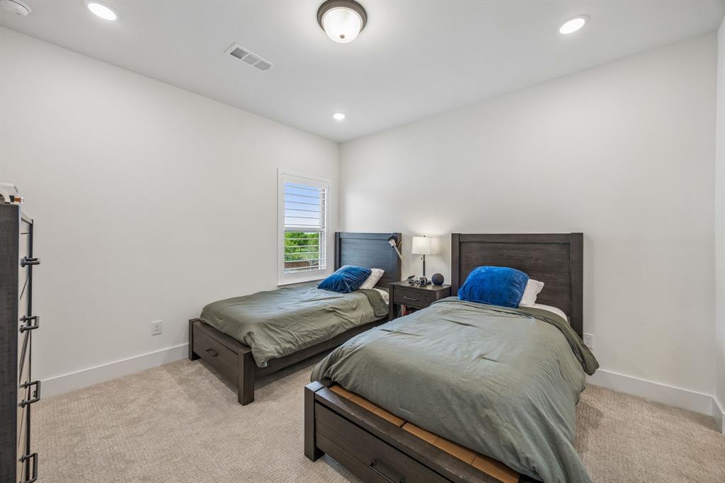 311 Pecan Trail Prosper, TX 75078 - Photo 22 of 39 a bedroom with two beds and painted walls