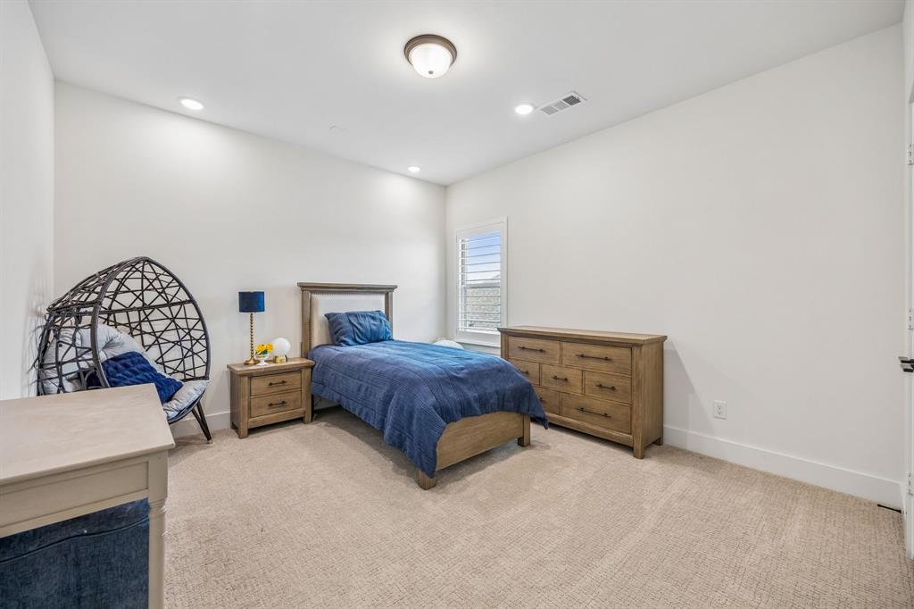 311 Pecan Trail Prosper, TX 75078 - Photo 24 of 39 a bedroom with a bed and a dresser