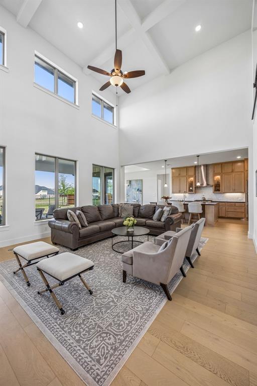 311 Pecan Trail Prosper, TX 75078 - Photo 26 of 39 a living room with lots of furniture and a rug
