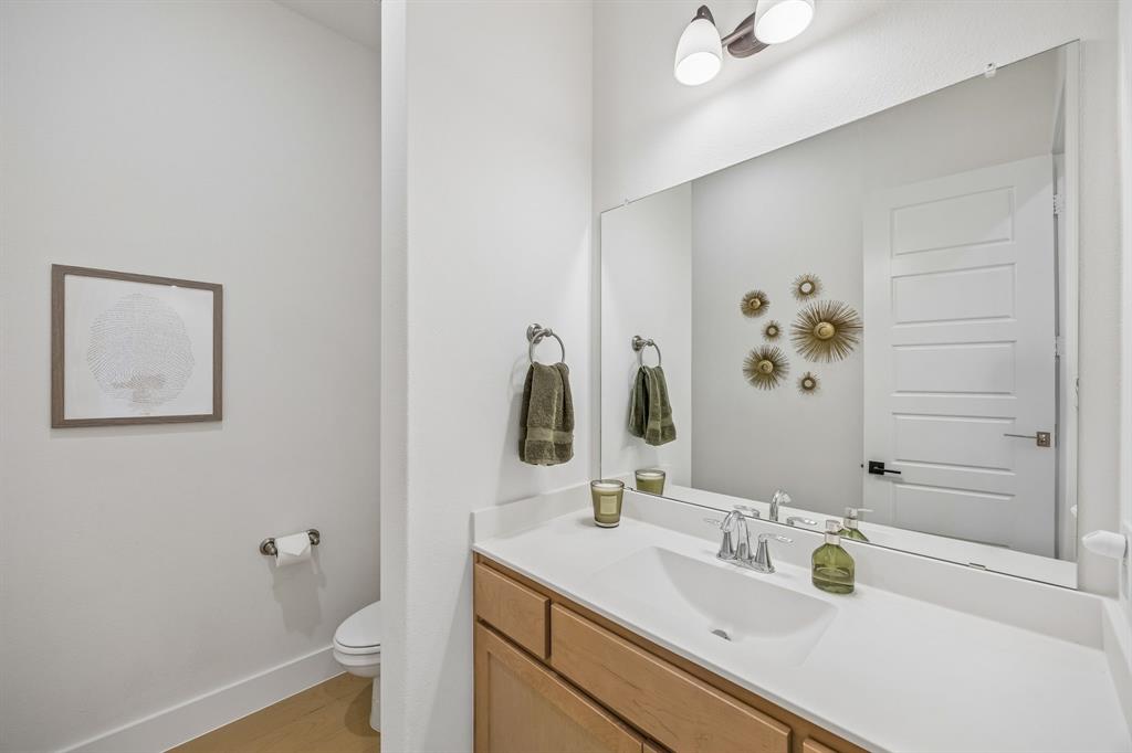 311 Pecan Trail Prosper, TX 75078 - Photo 35 of 39 a bathroom with a sink vanity granite and toilet