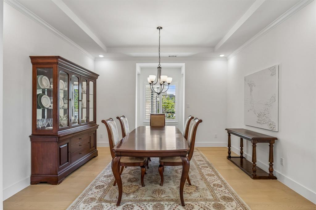 311 Pecan Trail Prosper, TX 75078 - Photo 6 of 39 a view of a dining room with furniture window and wooden floor