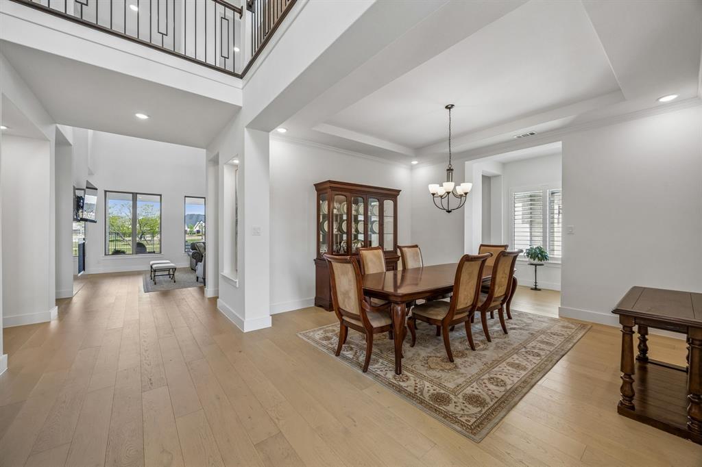 311 Pecan Trail Prosper, TX 75078 - Photo 7 of 39 a view of a livingroom with furniture window and wooden floor