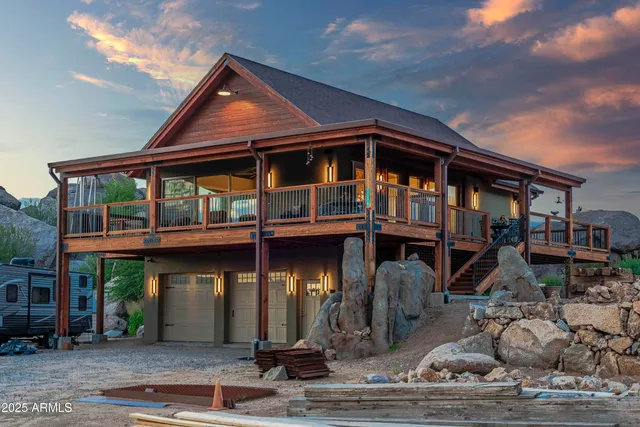 a view of a patio with table and chairs and wooden floor