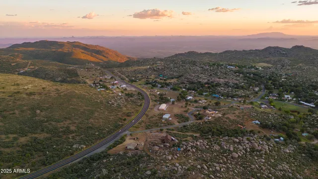 a view of a mountain range in a cloudy sky