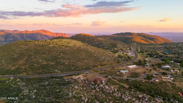 a view of a house with a mountain in the background