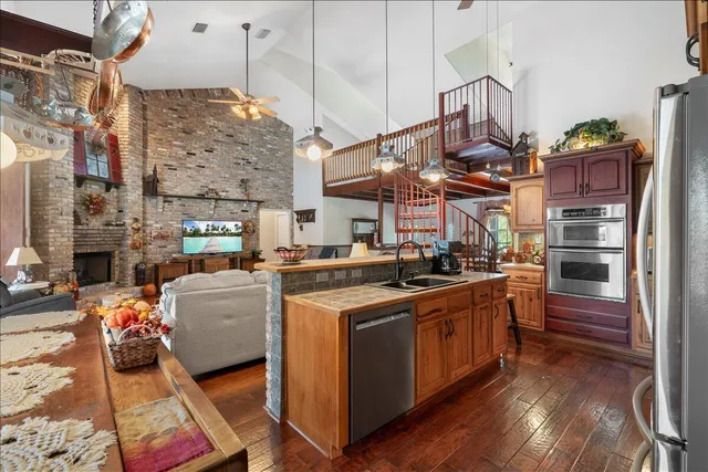 a spacious bathroom with a double vanity sink a mirror and a bathtub